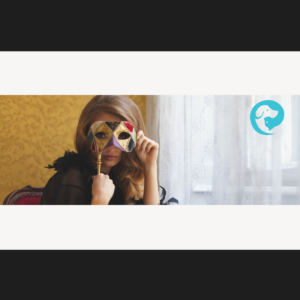 A woman in front of a sheer white curtain holding a mask in front of her face.