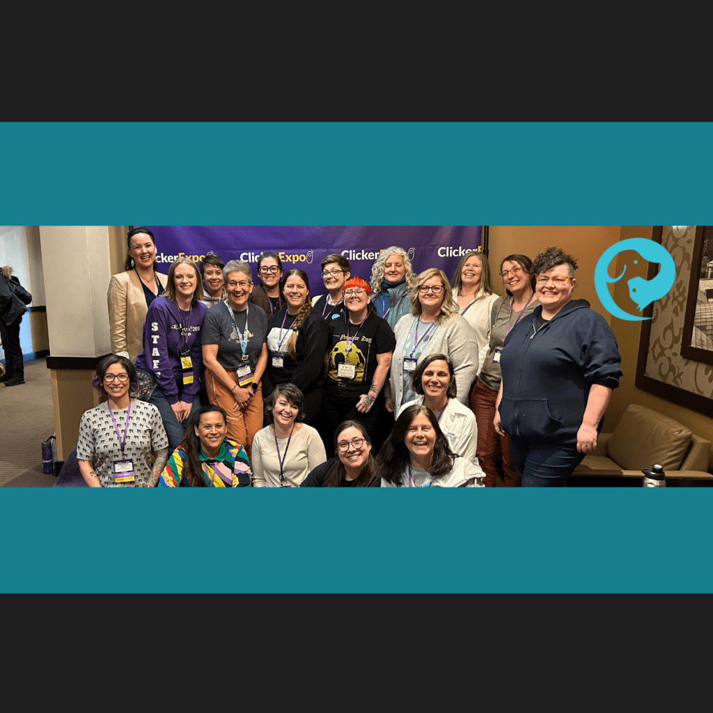 A group of people in front of banner for Clicker Expo (Karen Pryor Training Academy). This is our dog trainer community: PETPro!