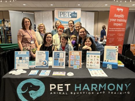 A group of people the Pet Harmony booth at Clicker Expo. PETPro community.
